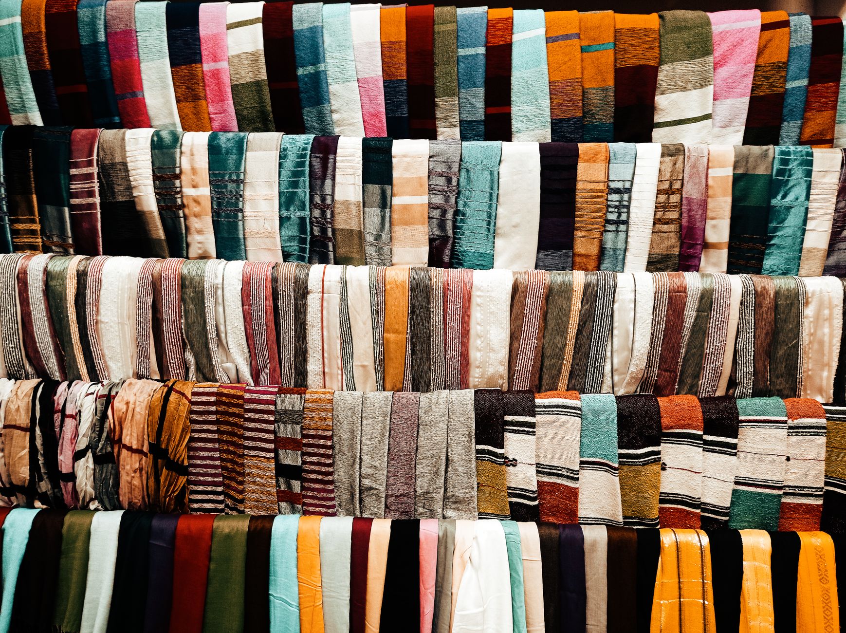 Accessorize with scarves styled across seasons and outfits